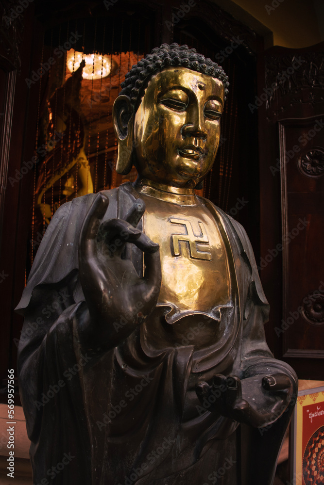 Bronze Buddha statue at Gangaramaya Temple, Colombo, Sri Lanka