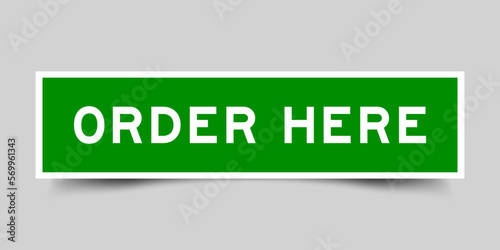 Green color square label sticker with word order here on gray background