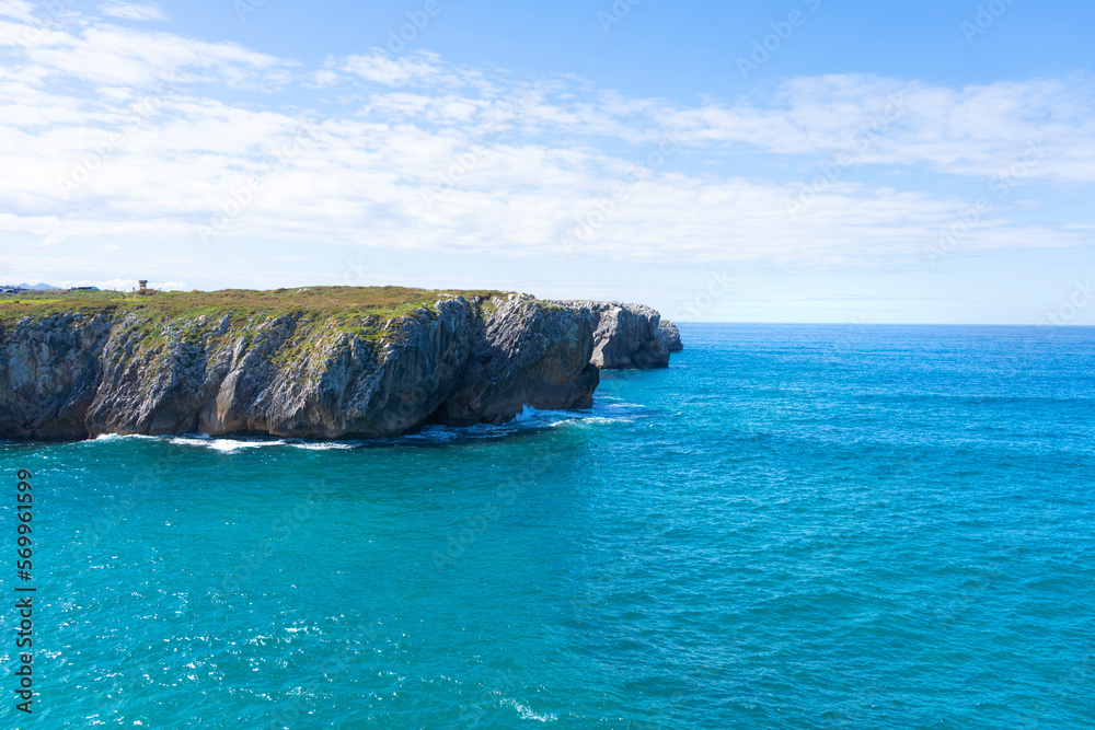 Blue sea. Cliff of rocks