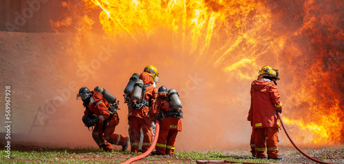 firefighter training new fireman team stop Fire from oil plant blast explode. Fire fighter sprinkle water stop fire burn emergency case at gas station. rescue Care System of Insurance team.