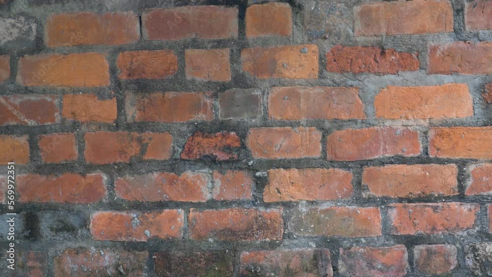 Close-up of an old authentic wall with red bricks, in Vietnam Close-up of an old authentic wall with red bricks, in Vietnam