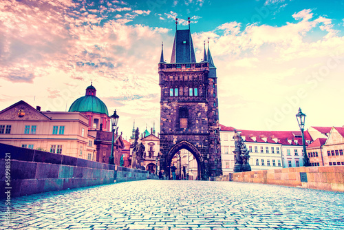 cute fascinating mystical landscape with arch-tower on Charles Bridge in an old city in Prague, Czech Republic at dawn. amazing places. popular tourist atraction
