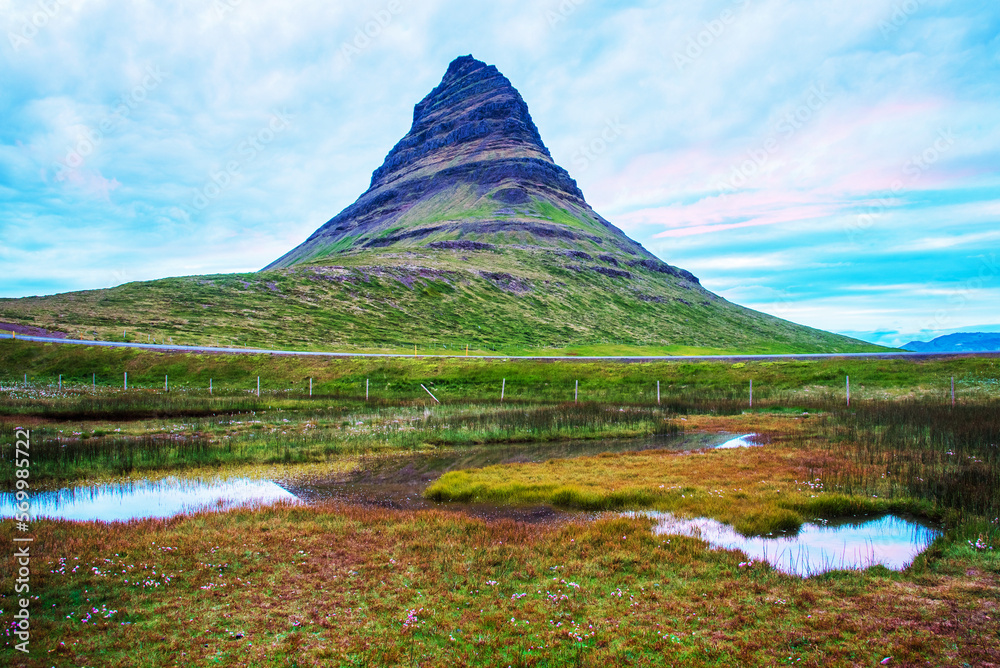charming captivating landscape with a volcano mountain Kirkjufell (Church Mountain) on Snæfellsnes Peninsula near town of Grundarfjörður in Iceland. Exotic countries.