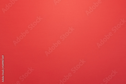 Panorama de fond uni en papier rouge pastel pour création d'arrière plan. 