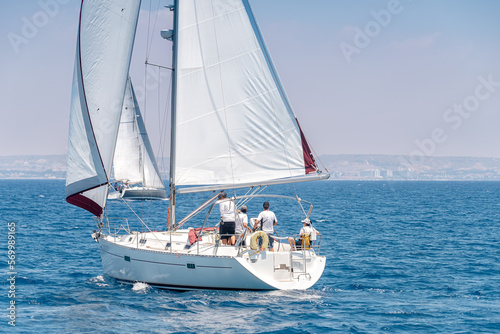 Crew of the yacht during the race in Mediterranean sea