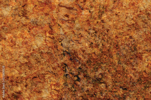 Raw pegmatite feldspar igneous rock terracotta pattern, rusty orange red golden amber yellow horizontal background, coarse light crystals texture large detailed bright textured minerals macro closeup