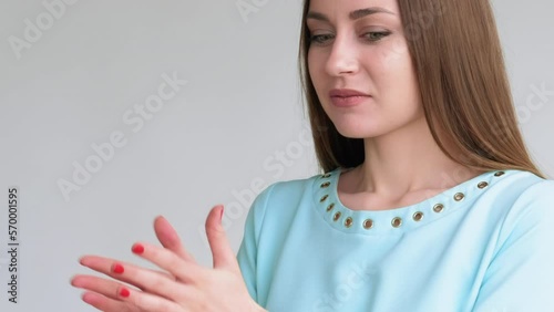 Fake discount. Holiday scam. Portrait of happy woman disappointed with taken away promised gift box isolated on light background. Bad surprise. Mean joke. Ruined fun.
