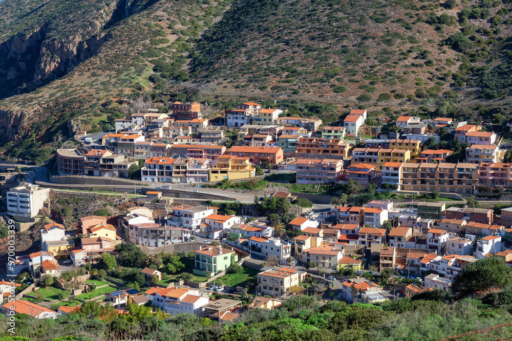 Town on the sea coast, Buggerru, Sardinia, Italy. Sunny Fall Season Day.