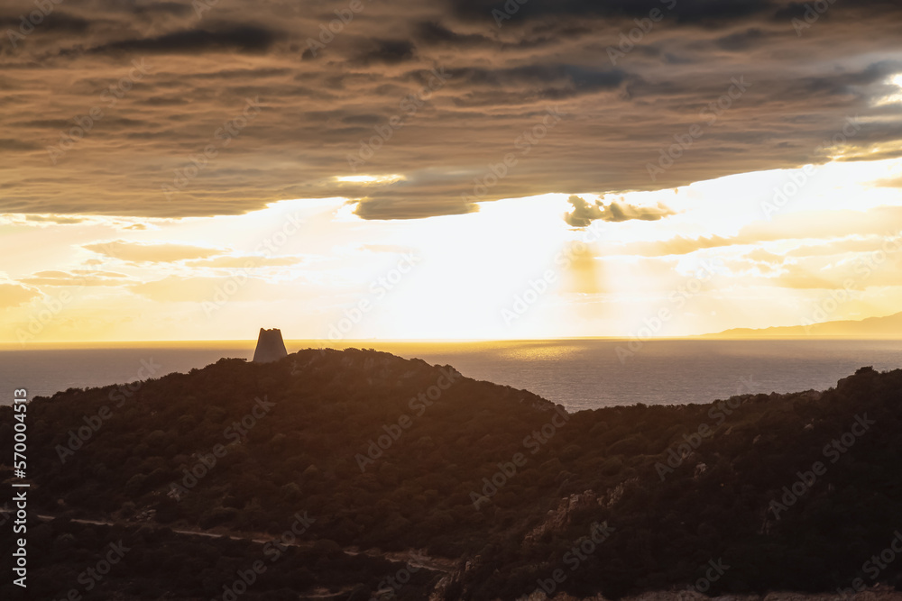 Rocky Coast by the Sea. Sardinia, Italy. Nature Background. Cloudy Sunset Sky. Rocky Coast by the Sea. Sardinia, Italy. Nature Background. Cloudy Sunset Sky.
