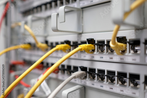 Network technology - multiple colorful cables in an IT and server room