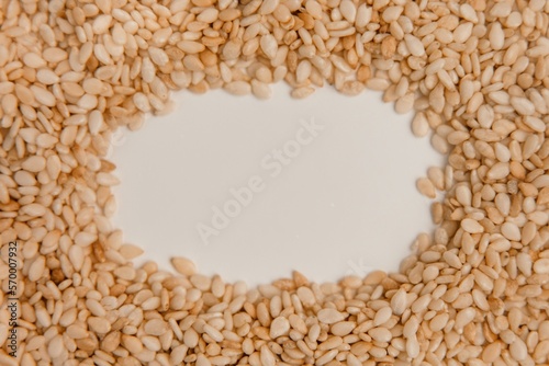 sesame seeds. Pile of white sesame seeds as background, top view