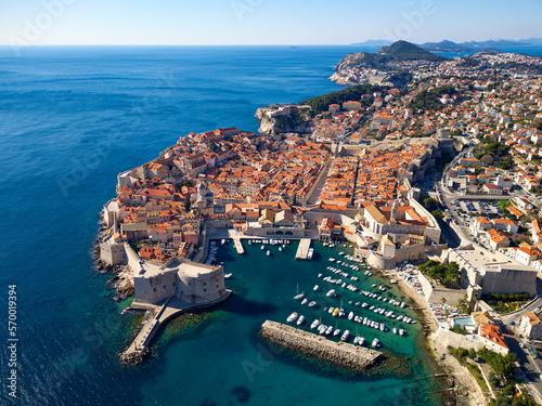 Aerial drone view of the Old historic city of Dubrovnik in Croatia, UNESCO World Heritage site. Famous tourist attraction in the Adriatic Sea. Fortified old city. Tourism and travel to Croatia.