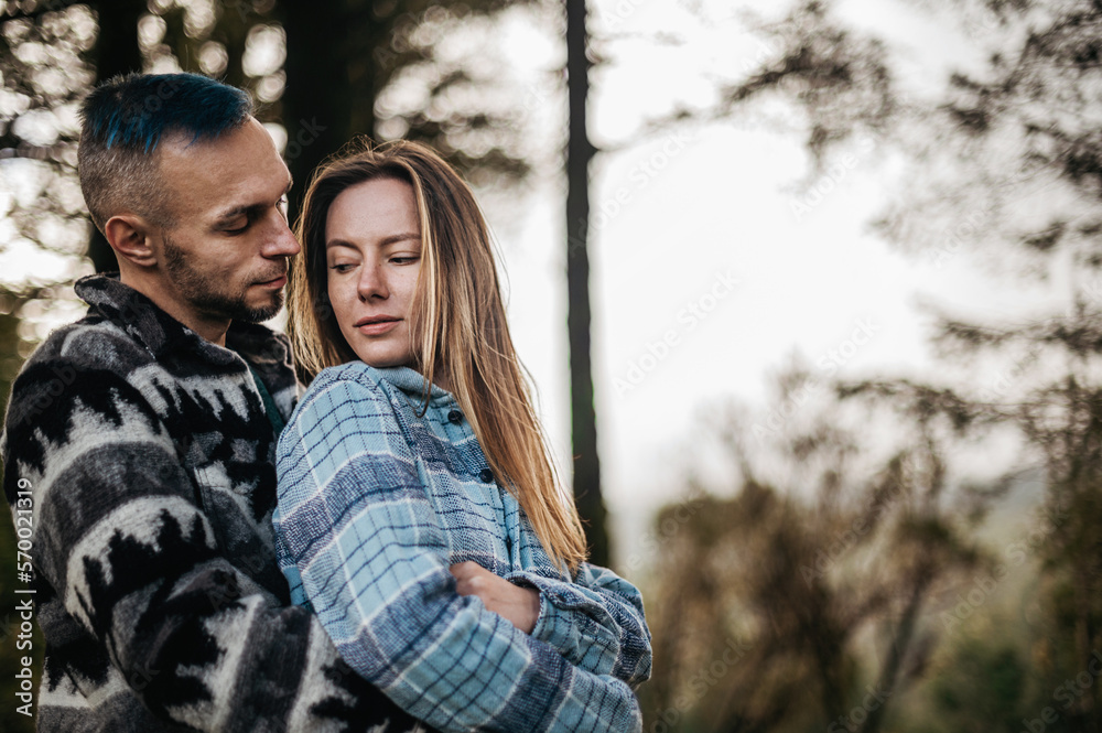 Couple embracing in an autumn park surrounded by the beauty of the fall season Couple embracing in an autumn park surrounded by the beauty of the fall season