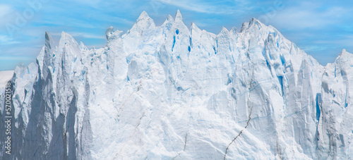 Glacier ice wall in Patagonia, ice texture and blue sky