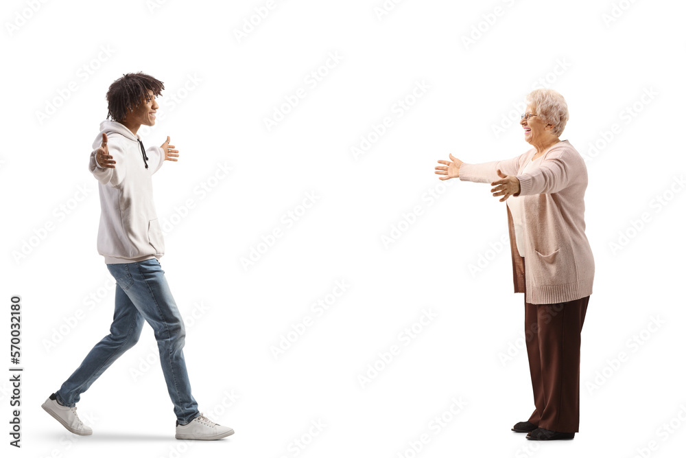 African american young man walking towards a caucasian elderly woman African american young man walking towards a caucasian elderly woman