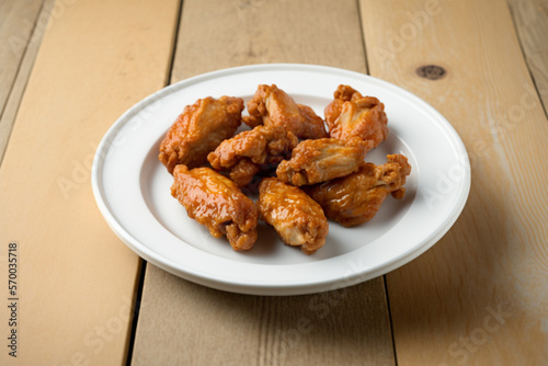 Delicous fried chicken, pan-fried and deep fried, with golden crisp coating on a nice plate. AI generated.