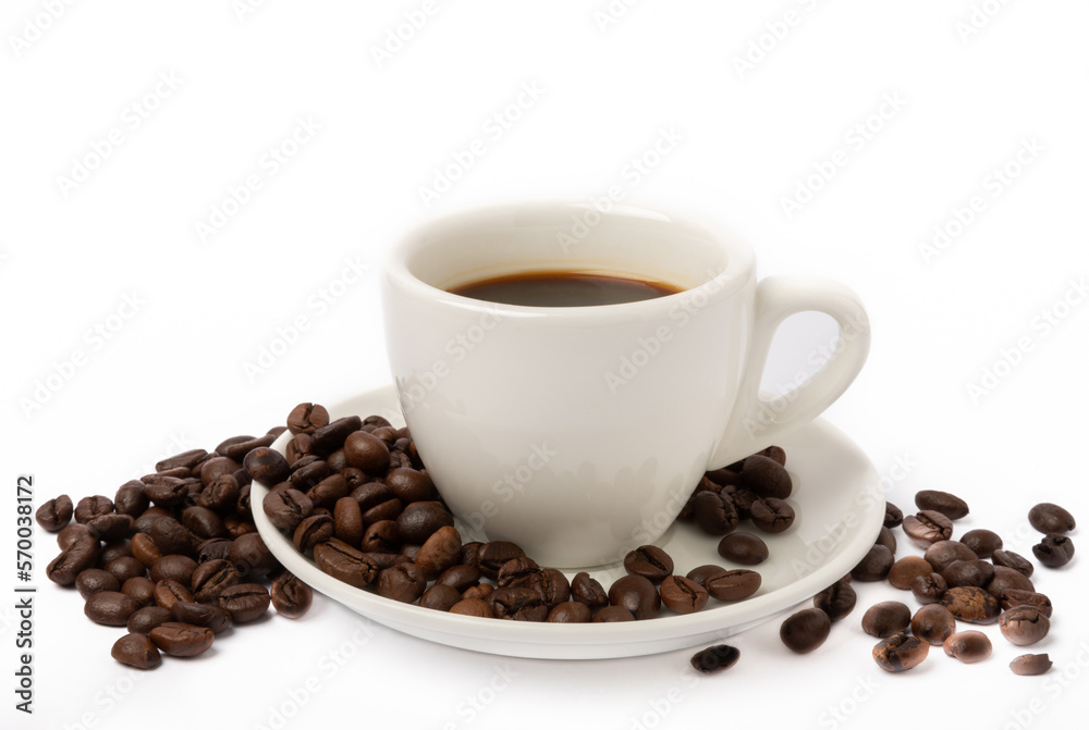 Coffee beans and a cup of stale strong espresso isolated on white background.