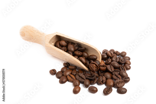 Coffee beans in wooden spoon isolated on white background.