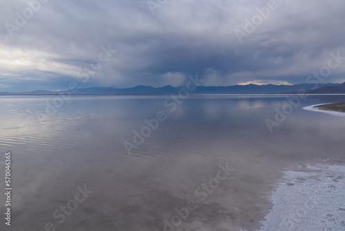 Scenic view of beautiful mountains reflecting in lake of Bonneville Salt Flats at sunset  Wendover  Western Utah  USA  America. Looking at summits of Silver Island Mountain range. Romantic atmosphere