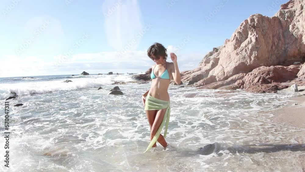 Woman dancing on the beach Woman dancing on the beach
