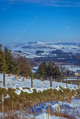 Farmland and mountains in the Brecon Beacons, Wales during winter.