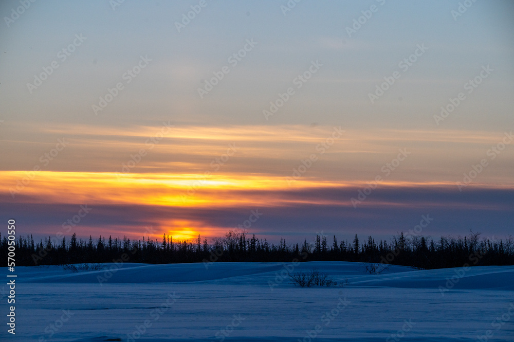 Cloudy sunset over the boreal forest in northern Canada