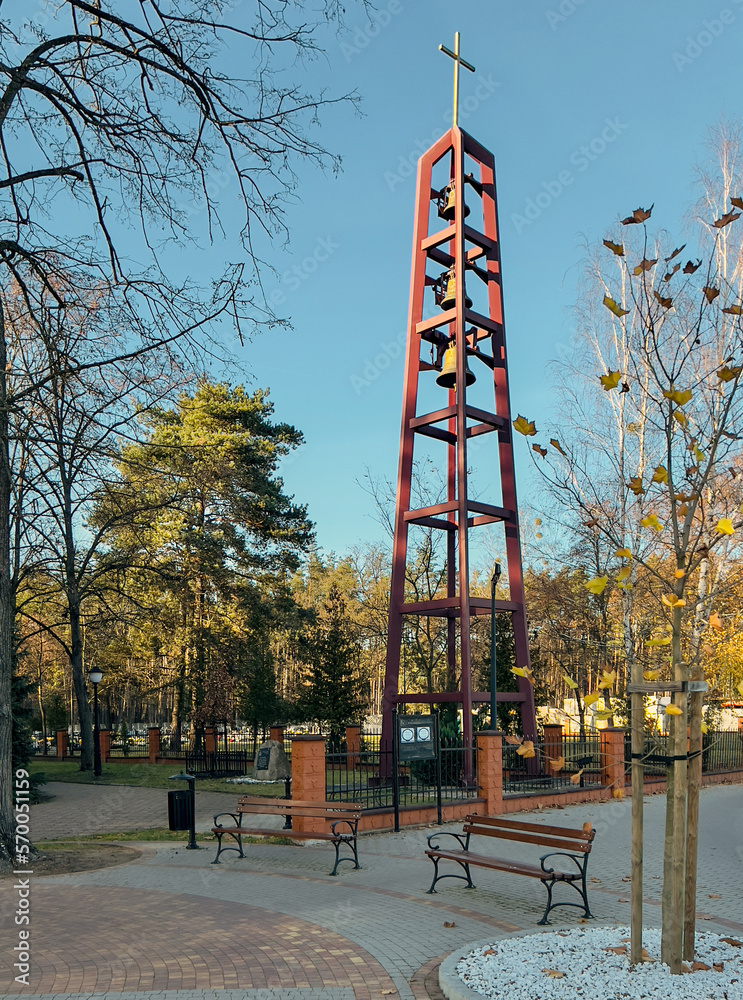Naklejka premium A free-standing belfry with three bells at the church in Miotek