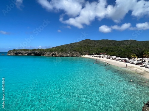 Grote Knip beach view of crystal clear blue green water in the carribean with a blue sky back ground. Curacao West Punt