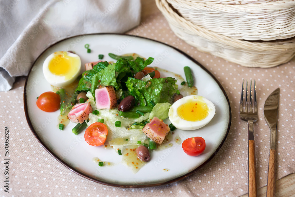 Nicoise tuna salad recipe made with fresh vegetables, boiled eggs, tuna, and olive oil