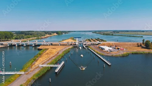 Aerial tracking drone shot of a bridge with boats in Zeewolde, The Netherlands photo