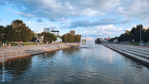 Embankment at the pond with people in the center of the city of Yekaterinburg.