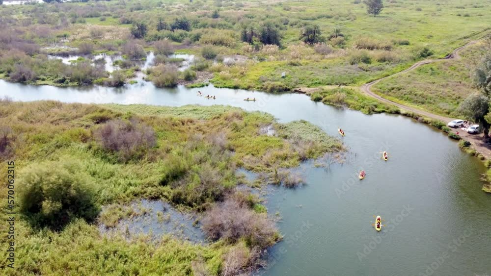 Sea of Galilee, Israel - 4 November 2022: Aerial view of people kayaking in a lake. Sea of Galilee, Israel - 4 November 2022: Aerial view of people kayaking in a lake.