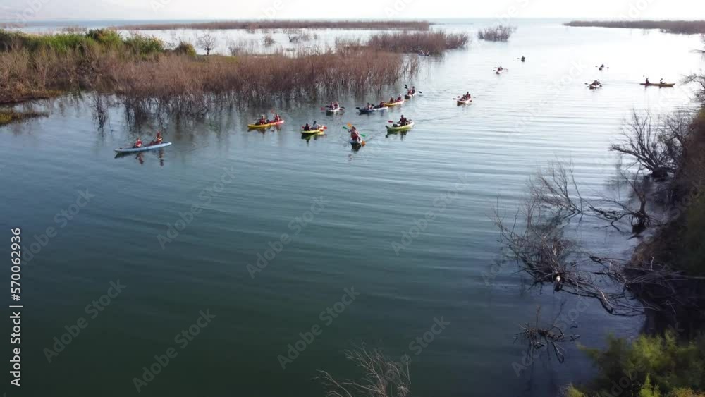 Sea of Galilee, Israel - 4 November 2022: Aerial view of people kayaking in a lake. Sea of Galilee, Israel - 4 November 2022: Aerial view of people kayaking in a lake.