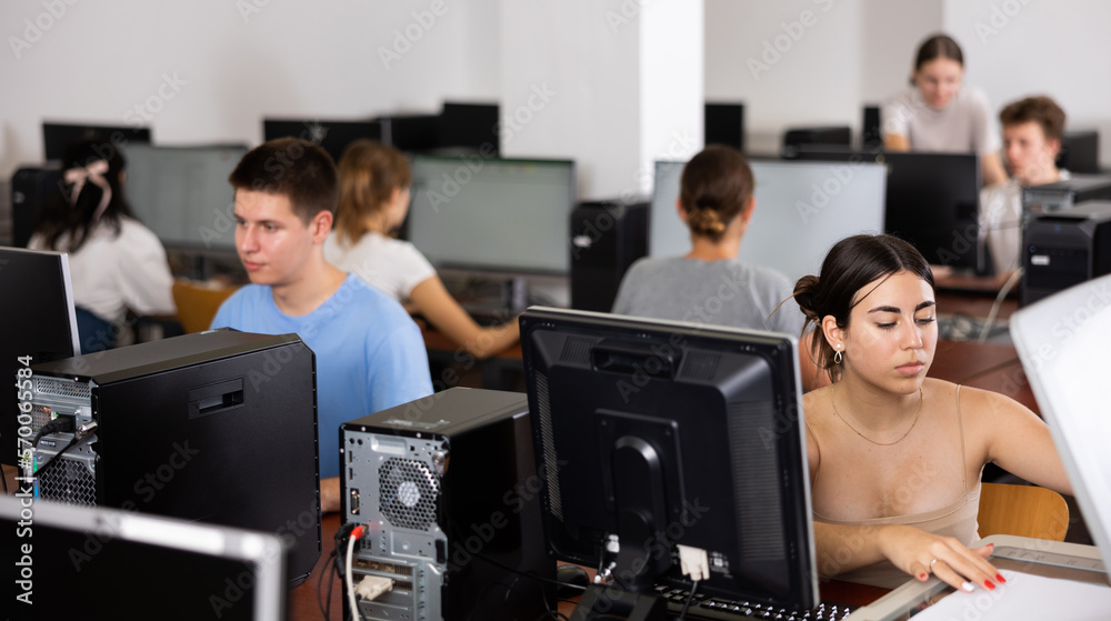 Interested girl student copying notes on copier while studying in ...