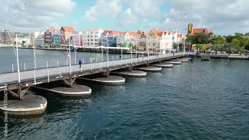 Wallpaper Mural Aerial shot of moving bridge in Downtown Willemsted historic city street colourful buildings with pastel-colored colonial architecture Torontodigital.ca