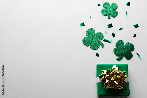 Image of green clover, green present and copy space on white background