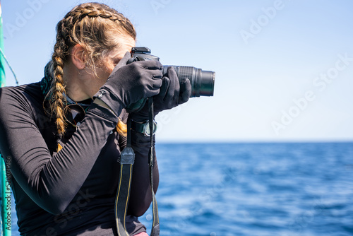 Profile of a concentrated marine biologist talking photos photo