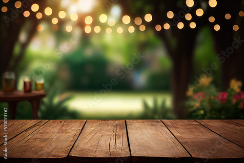 Empty wooden table with party in garden background blurred photo