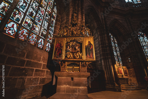 Statues of saints and icons in the ancient Coatolic Gothic Cathedral of Nuremberg, Germany photo