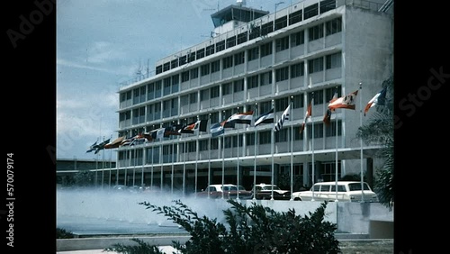 Flags of Many Nations 1963 - The flags of many nations fly in front of the terminal building at Isla Verde International Airport in San Juan, Puerto Rico in 1963.  photo