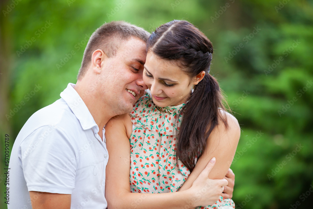 Happy young couple in love outdoors in park Happy young couple in love outdoors in park