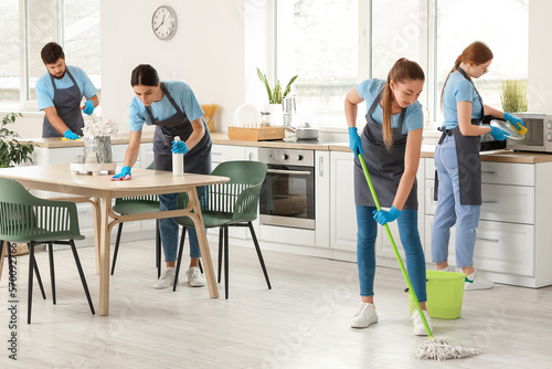 Young janitors cleaning in ...