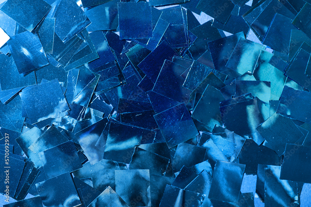 Blue confetti as background, closeup Blue confetti as background, closeup