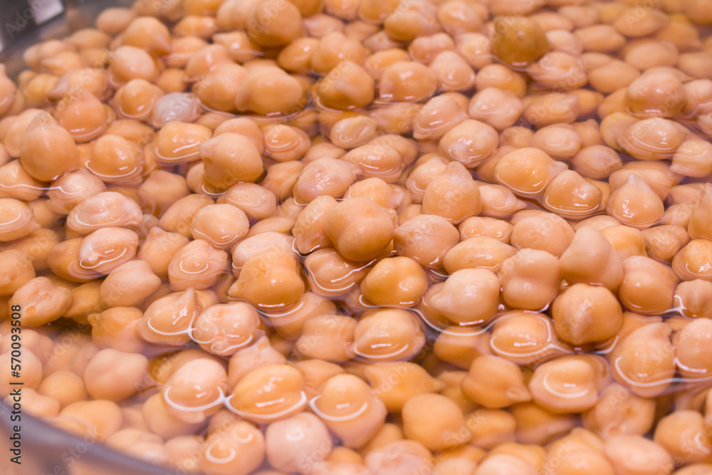 Top view on a group of soaked chickpeas on water Top view on a group of soaked chickpeas on water