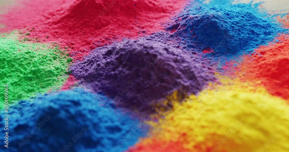 Video of close up of multi coloured powders with copy space on white background