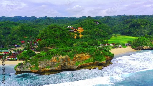 Aerial view of Sundak Beach with with white sands and rocks on the beach, Yogyakarta, Indonesia. photo