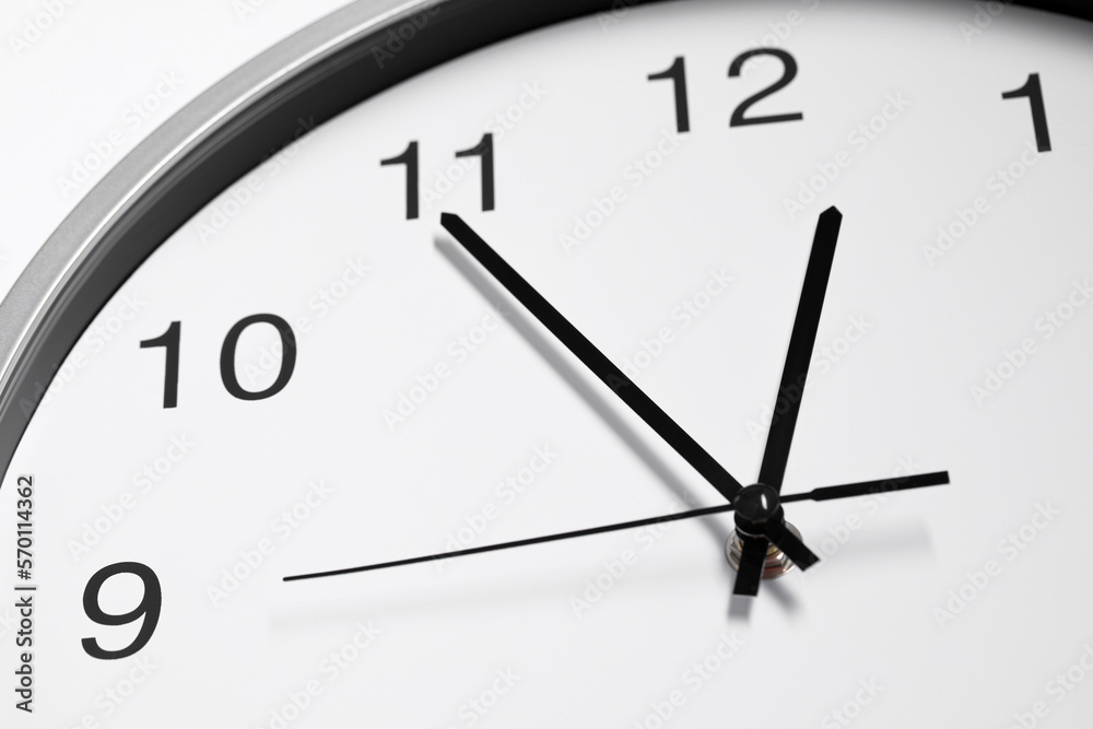 Stylish round clock on white background, closeup. Interior element Stylish round clock on white background, closeup. Interior element