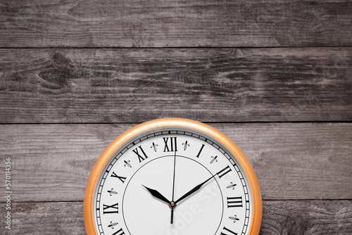 Wallpaper Mural Stylish round clock on wooden table, top view with space for text. Interior element Torontodigital.ca