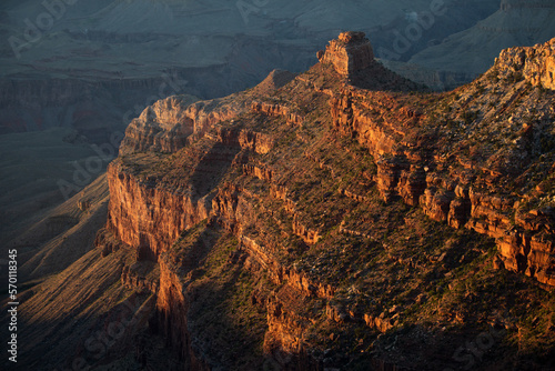Fototapeta Naklejka Na Ścianę i Meble -  Grand Canyon north rim at golden sunset. Rock canyon, rocky mountains. Canyon on the border of Nevada and Arizona. Desert mountain in National Park.