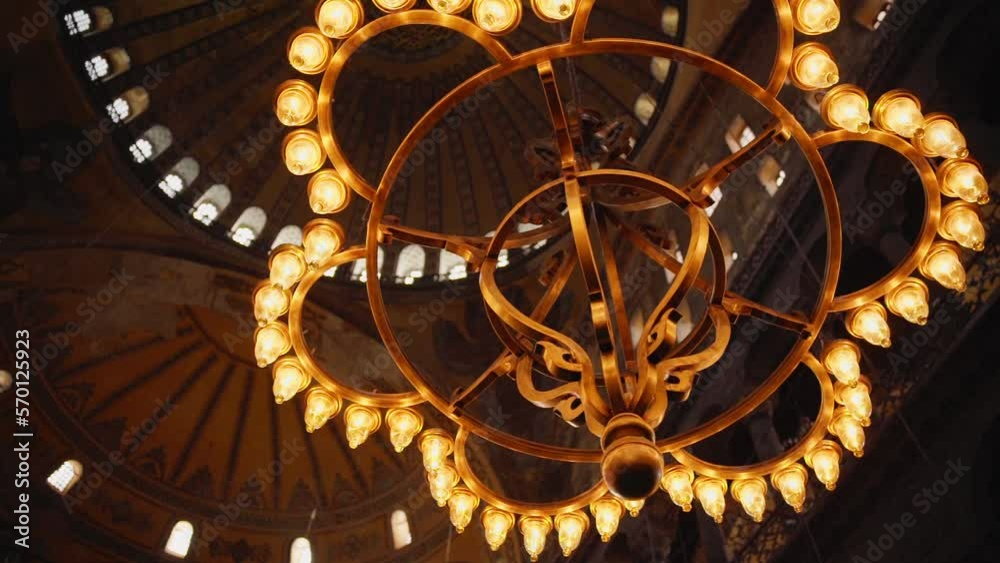 Ornate Chandelier Hanging From The Dome Of Hagia Sophia Grand Mosque In Istanbul, Turkey. closeup, low angle